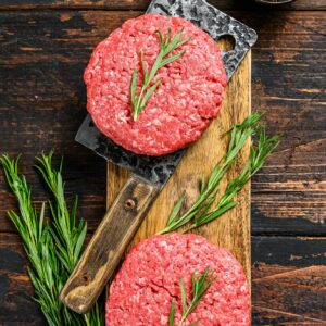 Ground raw meat patties. Meat cutlet ready to cook. Farm organic meat.