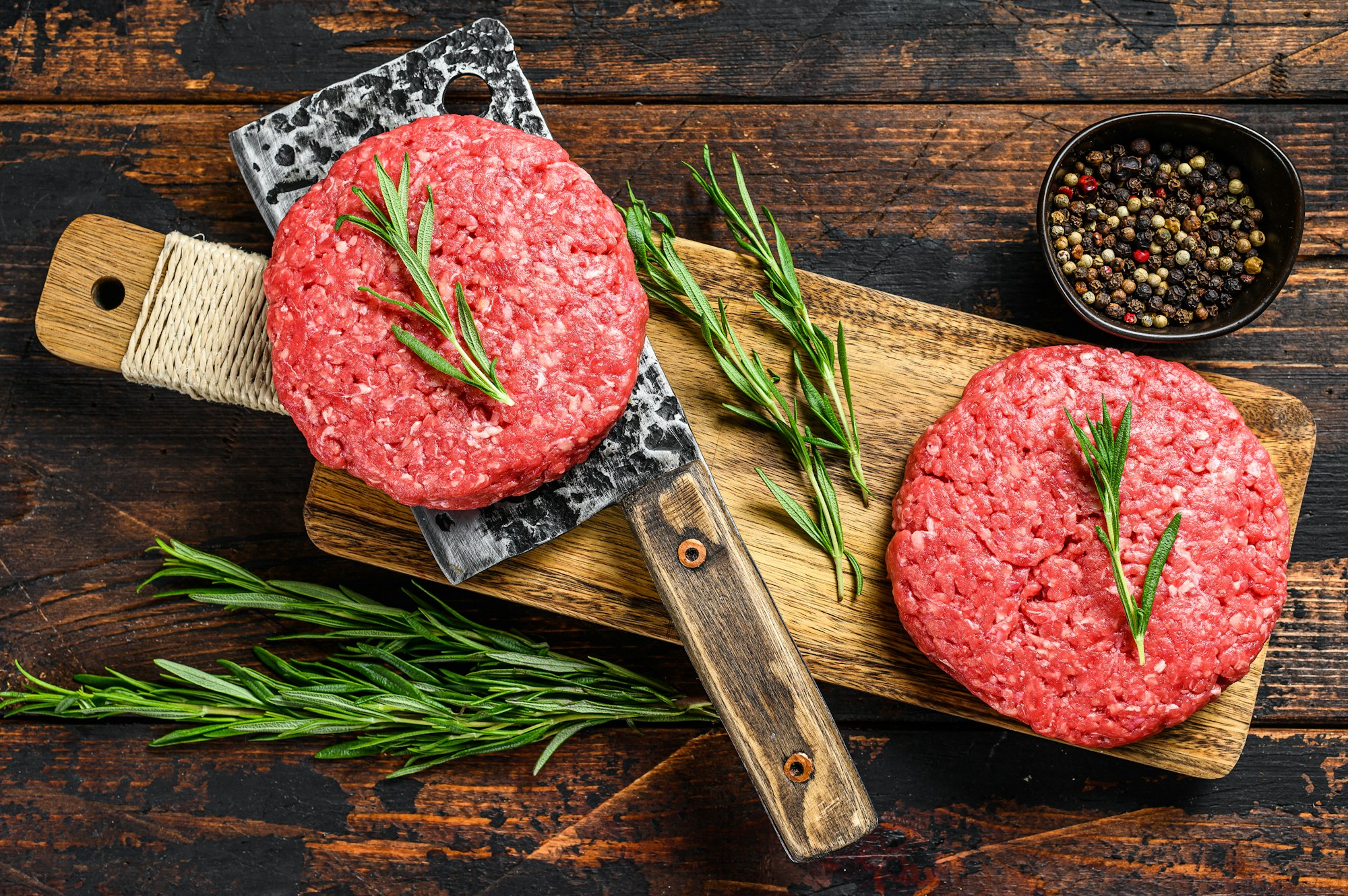 Ground raw meat patties. Meat cutlet ready to cook. Farm organic meat.