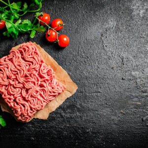 Raw minced meat with parsley and tomatoes.